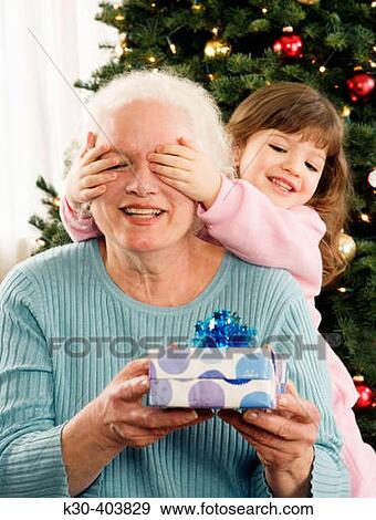 Grandmother and child with Christmas gifts. View Large Photo Image Stock Photo - Grandmother and child with Christmas gifts.. Fotosearch