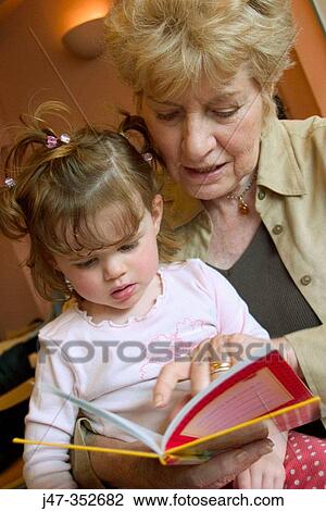 Grandmother and granddaughter reading View Large Photo Image Stock Image - Grandmother and granddaughter reading. Fotosearch