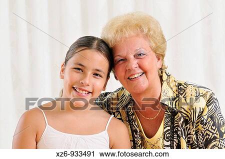 Grandmother and granddaughter smiling View Large Photo Image Stock Image - Grandmother and granddaughter smiling. Fotosearch