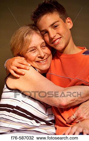Grandmother being hugged by her grandson. View Large Photo Image Stock Image - Grandmother being hugged by her grandson.. Fotosearch