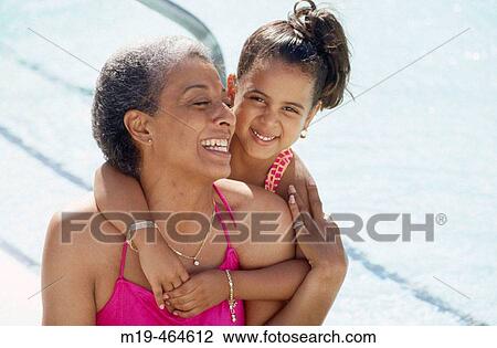 grandmother with grandaughter at a pool View Large Photo Image Stock Image - grandmother with grandaughter at a pool. Fotosearch