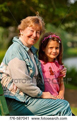 Stock Image - Grandmother with her granddaughter.. Fotosearch