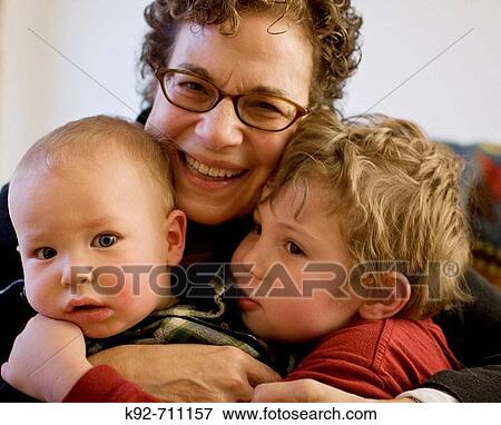 Stock Photo - Grandmother with toddler grandsons.. Fotosearch