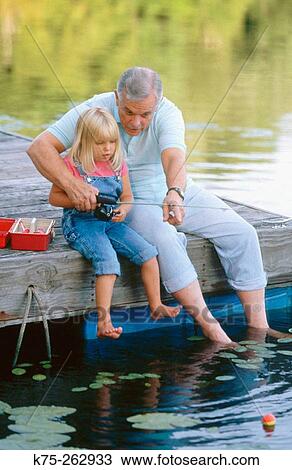 Grandpa and granddaughter fishing View Large Photo Image Stock Image - Grandpa and granddaughter fishing. Fotosearch