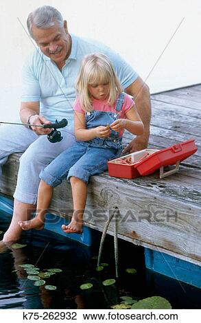 Grandpa fishing with granddaughter View Large Photo Image Stock Image - Grandpa fishing with granddaughter. Fotosearch