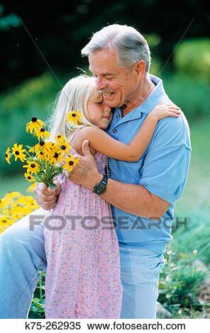 Grandpa gets a hug View Large Photo Image Stock Photography - Grandpa gets a hug. Fotosearch