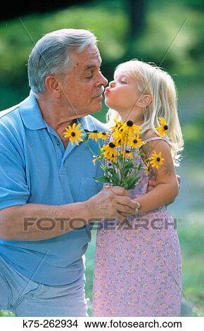 Picture - Grandpa gets a kiss. Fotosearch