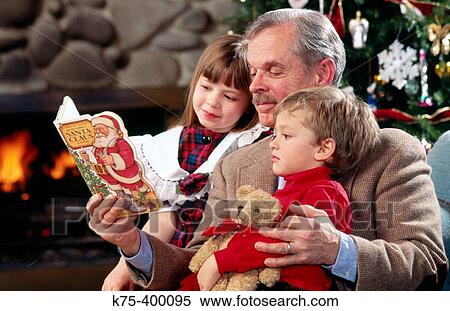 Grandpa reading Christmas story to children View Large Photo Image Stock Photography - Grandpa reading Christmas story to children. Fotosearch