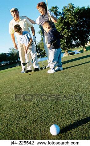 Grandparetns playing golf with their grandsons View Large Photo Image Stock Image - Grandparetns playing golf with their grandsons. Fotosearch