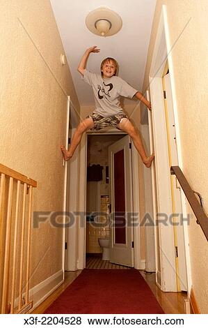Grandson age 10 performing for grandfather while parents are safely downstairs. St Paul Minnesota MN USA. View Large Photo Image Stock Photo - Grandson age 10 performing for grandfather while parents are safely downstairs. St Paul Minnesota MN USA.. Fotosearch