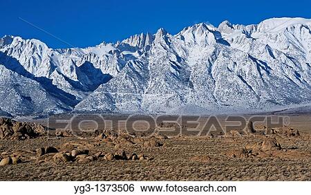 Granite rock formations of Alabama Hills with Mount Whitney and Sierra Nevada mountains in background, California View Large Photo Image Stock Photograph - Granite rock formations of Alabama Hills with Mount Whitney and Sierra Nevada mountains in background, California. Fotosearch