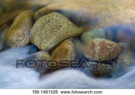 Granite rocksunder flowing water in the Merced River, Yosmite Valley, Yosemite National Park, California View Large Photo Image Stock Photograph - Granite rocksunder flowing water in the Merced River, Yosmite Valley, Yosemite National Park, California. Fotosearch