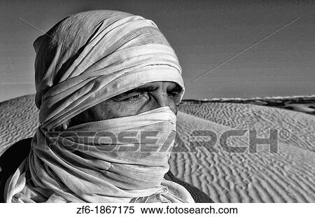 Graphic portrait of Bedouin man in Sahara Desert with sand in Douz Tunisia Africa View Large Photo Image Stock Photography - Graphic portrait of Bedouin man in Sahara Desert with sand in Douz Tunisia Africa. Fotosearch