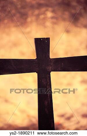 Stock Image - Grave with christian cross. Fotosearch