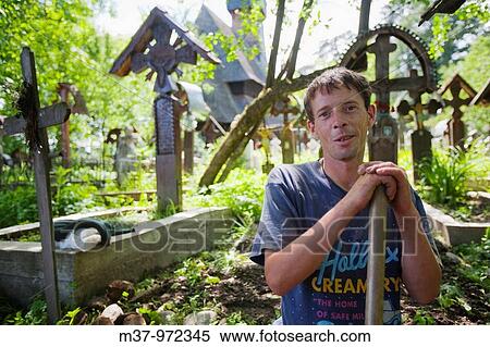 Gravedigger at Lemn din Deal church cemetery Ieud Maramures Romania MRR0901 View Large Photo Image Stock Photography - Gravedigger at Lemn din Deal church cemetery Ieud Maramures Romania MRR0901. Fotosearch