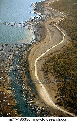 Stock Photograph - Gravel way and seashore, aerial view. F? ro. Gotland. Sweden.. Fotosearch