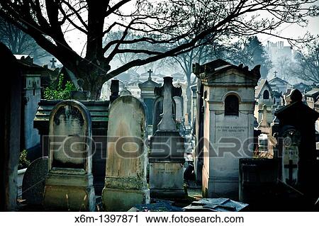 Stock Image - Graves in Pere Lachaise Cemetery Paris, France, Europe. Fotosearch