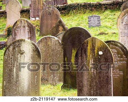 Stock Photo - Gravestones in churchyard, Baslow village, Derbyshire, UK. Fotosearch