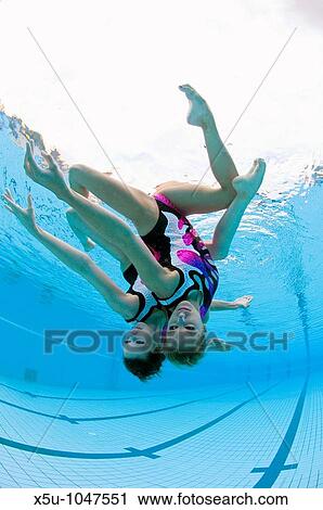 Great Britain synchronised swimming team duet competitors, Jenna Randall 20, left and Olivia Allison 19 Shot at the heated pool of 1930's Guildford Lido, Surrey UK View Large Photo Image Stock Image - Great Britain synchronised swimming team duet competitors, Jenna Randall 20, left and Olivia Allison 19 Shot at the heated pool of 1930's Guildford Lido, Surrey UK. Fotosearch