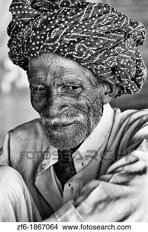 Picture - Great colorful portrait of local Hindu old man in turban in small village of Charu near Ranthambore in Rajasthan India. Fotosearch