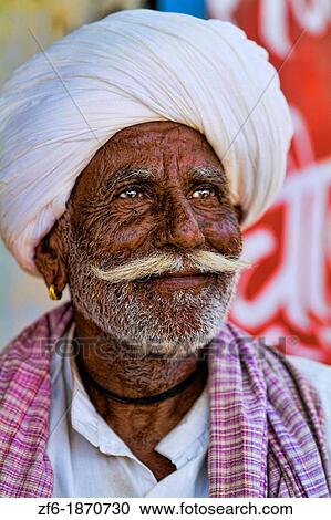 Great colorful portrait of local Hindu old man in turban in small village of Charu near Ranthambore in Rajasthan India View Large Photo Image Stock Image - Great colorful portrait of local Hindu old man in turban in small village of Charu near Ranthambore in Rajasthan India. Fotosearch