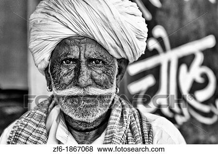 Great colorful portrait of local Hindu old man in turban in small village of Charu near Ranthambore in Rajasthan India View Large Photo Image Stock Photo - Great colorful portrait of local Hindu old man in turban in small village of Charu near Ranthambore in Rajasthan India. Fotosearch