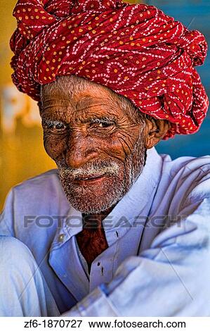 Great colorful portrait of local Hindu old man in turban in small village of Charu near Ranthambore in Rajasthan India View Large Photo Image Stock Photo - Great colorful portrait of local Hindu old man in turban in small village of Charu near Ranthambore in Rajasthan India. Fotosearch