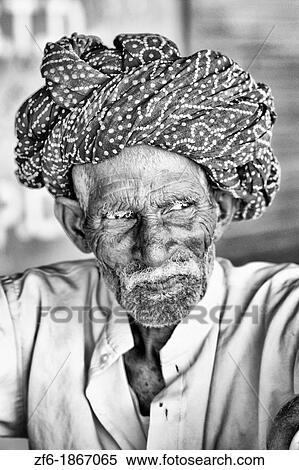 Great colorful portrait of local Hindu old man in turban in small village of Charu near Ranthambore in Rajasthan India View Large Photo Image Stock Photography - Great colorful portrait of local Hindu old man in turban in small village of Charu near Ranthambore in Rajasthan India. Fotosearch