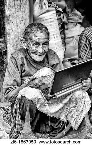 Great image of modern technology with old woman and new laptop computer in village of Bhaktapur a town near Kathmandu Nepal View Large Photo Image Stock Image - Great image of modern technology with old woman and new laptop computer in village of Bhaktapur a town near Kathmandu Nepal. Fotosearch