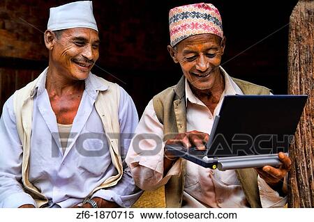 Great image of modern technology with local Hindu men and new laptop computer in village of Bhaktapur a town near Kathmandu Nepal View Large Photo Image Stock Photography - Great image of modern technology with local Hindu men and new laptop computer in village of Bhaktapur a town near Kathmandu Nepal. Fotosearch