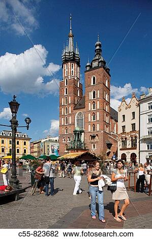 Great Market Square or Main Square, Basilica of the Virgin Mary, 14th century, Gothic Cathedral, Cracow, Krakow, Poland View Large Photo Image Stock Image - Great Market Square or Main Square, Basilica of the Virgin Mary, 14th century, Gothic Cathedral, Cracow, Krakow, Poland. Fotosearch
