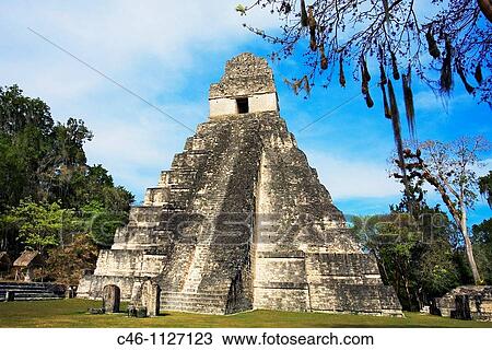Stock Image - Great Plaza and Temple of the Giant Jaguar. Temple I. Mayan ruins of Tikal. Guatemala.. Fotosearch