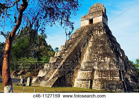 Stock Photo - Great Plaza and Temple of the Giant Jaguar. Temple I. Mayan ruins of Tikal. Guatemala.. Fotosearch