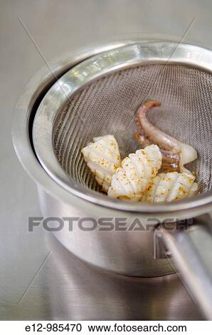 Greece, Athens, restaurant Spondi, chef Arnaud Bignon 2* chef, fixing a greek paella. View Large Photo Image Stock Image - Greece, Athens, restaurant Spondi, chef Arnaud Bignon 2* chef, fixing a greek paella.. Fotosearch