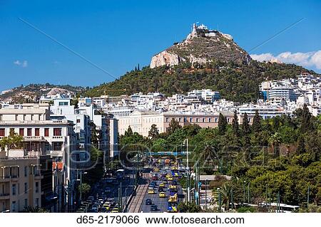 Stock Photograph - Greece, Central Greece Region, Athens, elevated view of Syngrou Avenue and Lycabettus Hill.. Fotosearch