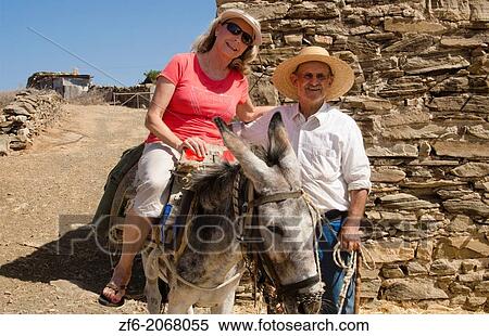 Greece Paros Cyclades old local man with donkey near Lefkes in mountains at his farm home with woman tourist on donkey 8 4. View Large Photo Image Stock Photography - Greece Paros Cyclades old local man with donkey near Lefkes in mountains at his farm home with woman tourist on donkey 8 4.. Fotosearch