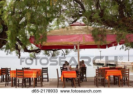 Greece, Thessaly Region, Milina, Pelion Peninsula, waterfront cafe. View Large Photo Image Stock Image - Greece, Thessaly Region, Milina, Pelion Peninsula, waterfront cafe.. Fotosearch