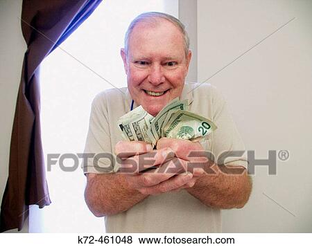 Stock Photo - greed and money. Fotosearch