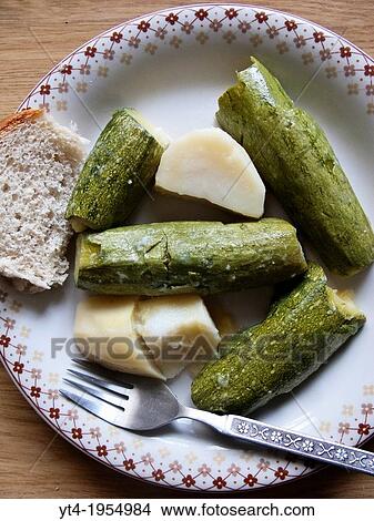 Greek Cuisine. A simple Village Meal of Courgettes with Potatoes. View Large Photo Image Picture - Greek Cuisine. A simple Village Meal of Courgettes with Potatoes.. Fotosearch