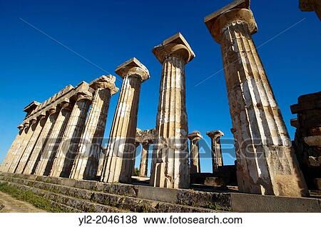 Greek Dorik columns at the ruins of Temple F at Selinunte, Sicily View Large Photo Image Stock Photo - Greek Dorik columns at the ruins of Temple F at Selinunte, Sicily. Fotosearch