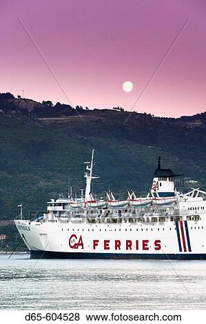 Greek Island Ferry with Moonset. Dawn. Vathy (Samos town). Samos. Northeastern Aegean Islands. Greece. View Large Photo Image Stock Photo - Greek Island Ferry with Moonset. Dawn. Vathy (Samos town). Samos. Northeastern Aegean Islands. Greece.. Fotosearch