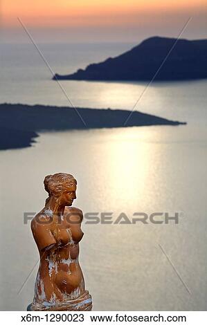 Greek statue in Fira village. Santorini island, Cyclades islands, Aegean Sea, Greece, Europe View Large Photo Image Stock Image - Greek statue in Fira village. Santorini island, Cyclades islands, Aegean Sea, Greece, Europe. Fotosearch
