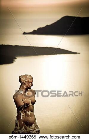 Greek statue in Fira village Santorini island, Cyclades islands, Aegean Sea, Greece, Europe View Large Photo Image Stock Photography - Greek statue in Fira village Santorini island, Cyclades islands, Aegean Sea, Greece, Europe. Fotosearch