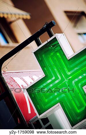 Green cross signal of a pharmacy in Valencia, Spain View Large Photo Image Stock Photo - Green cross signal of a pharmacy in Valencia, Spain. Fotosearch