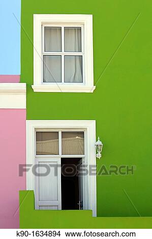 Green wall with one window and entrance door with white frame, clear, blue sky, Bo-Kaap Malay Muslim District, Cape Town, South Africa View Large Photo Image Picture - Green wall with one window and entrance door with white frame, clear, blue sky, Bo-Kaap Malay Muslim District, Cape Town, South Africa. Fotosearch