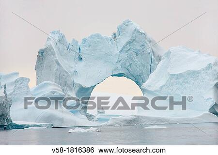 Greenland, Melville Bay, Cape York, Arch shaped iceberg View Large Photo Image Stock Photograph - Greenland, Melville Bay, Cape York, Arch shaped iceberg. Fotosearch
