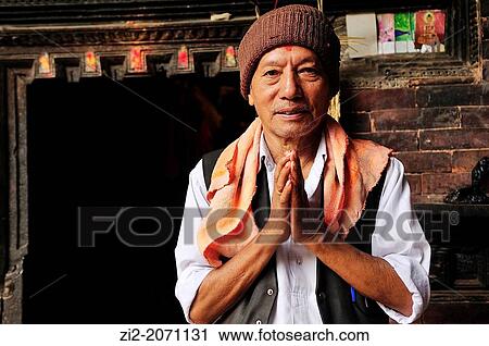 Greeting ritual of a Buddhist man, Bhaktapur, Nepal View Large Photo Image Stock Image - Greeting ritual of a Buddhist man, Bhaktapur, Nepal. Fotosearch