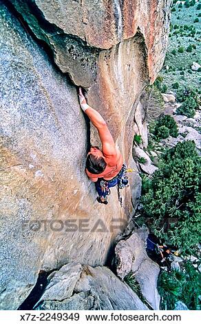 Greg Moore rock climbing a route called Shake n Flake which is rated 5, 10 and located on the Comp Wall at Castle Rocks State Park near the town of Almo in southern Idaho. View Large Photo Image Stock Photo - Greg Moore rock climbing a route called Shake n Flake which is rated 5, 10 and located on the Comp Wall at Castle Rocks State Park near the town of Almo in southern Idaho.. Fotosearch