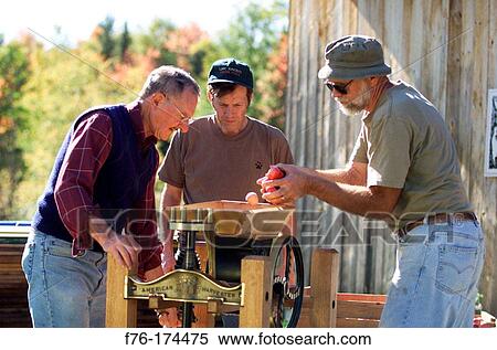 Griding apples to place in manual cedar press. Groveton. New Hampshire. USA View Large Photo Image Stock Photography - Griding apples to place in manual cedar press. Groveton. New Hampshire. USA. Fotosearch