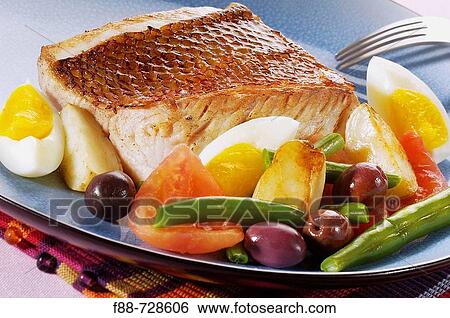 Grilled fish with hard boiled eggs and vegetables and olives, food View Large Photo Image Stock Photograph - Grilled fish with hard boiled eggs and vegetables and olives, food. Fotosearch